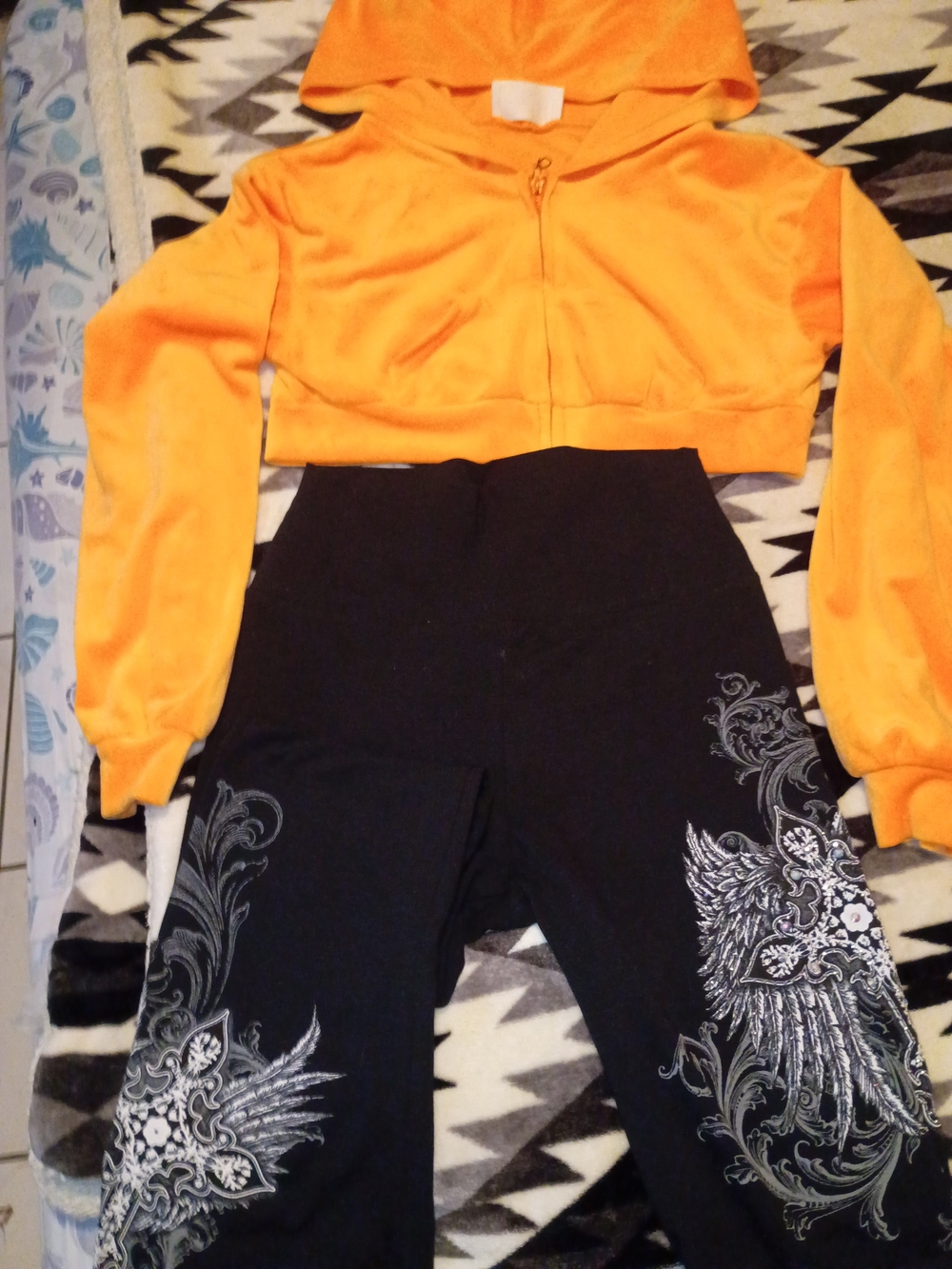 Bright Orange Cropped Hoodie with Black Graphic Leggings